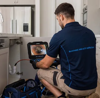 Clearing a blocked sink at a Leppington property